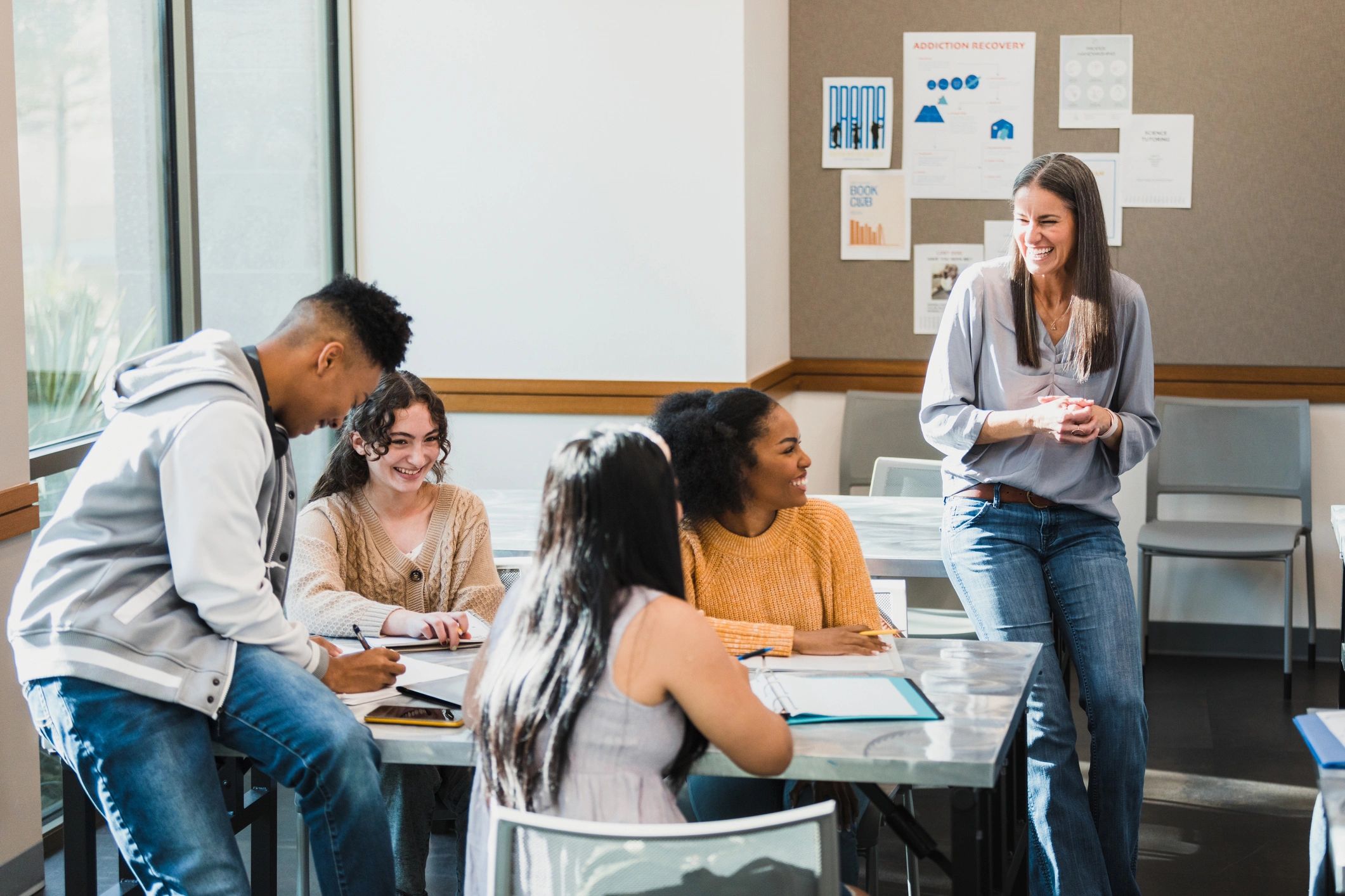 Professor engaging students during an academic workshop