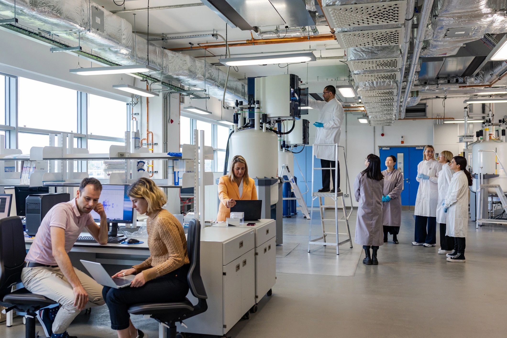 Scientists reviewing research data together in a laboratory