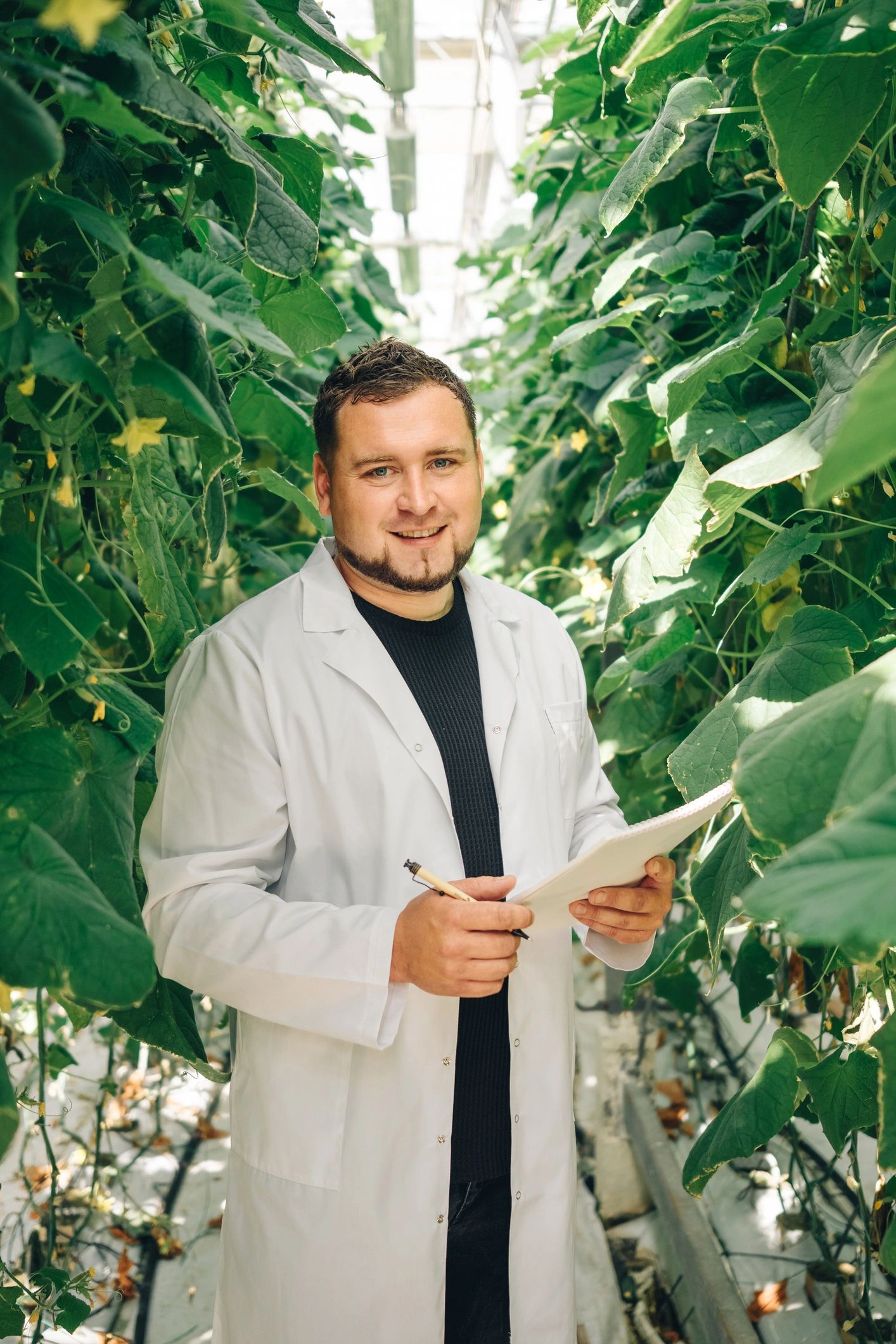 Portrait of a scientist in a greenhouse